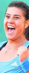 Romanias Sorana Cirstea jubilates after beating Serbias Jelena Jankovic at Roland Garros on Monday .
