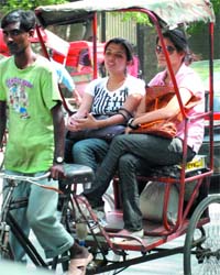 Students take rickshaw to get admission forms in different collages on the North Campus