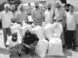 The accused in police custody with poppy husk at Rajpura on Thursday.