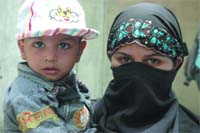 Rescued kid Amanullah with his mother at Delhi police press conference in New Delhi 