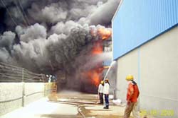 Firefighters douse the fire that broke out at a garment godown of Vishal Mega Mart in Gurgaon