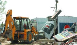 Kiosks and shelters being demolished near Attari joint check post