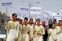 Students of Baba Farid Institute of Higher and Foreign Studies carrying out a 'Chetna March' on the World Environment Day in Bathinda on Friday.