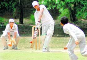 A batsman plays a shot during a cricket match in Chandigarh