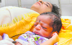 The newly born baby boy with his mother at the Civil Hospital, Barnala on Thursday night.