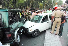 A Maruti car jumps the median and hits the official vehicle of a Commandant of the BSF near district courts in Jalandhar