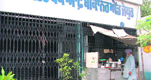 With no security guard, a tea stall owner takes care of this bank.