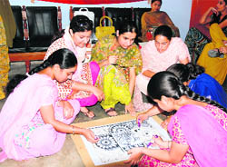 Fine arts teachers train NSS volunteers of Guru Nanak National College during a camp at Doraha.