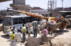 A crane fell on a mini-bus near the railway overbridge in Malout on Sunday, but luckily, no casualty was reported.
