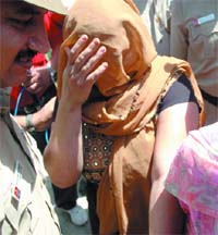 Sunita held for murder of her husband in New Delhi on Sunday. 