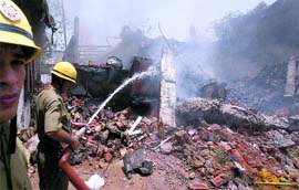 Delhi fire personnel try to douse the fire at the factory in Okhla, Phase 2, New Delhi on Sunday morning.