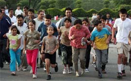Residents participate in a marathon race in Gurgaon on Sunday