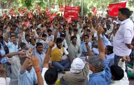 Employees of AITUC stage a protest in support of their demands in Gurgaon on Sunday. 