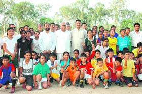 Uttarakhand Speaker Harbans Kapoor with the children, who participated in the football camp organised by Vijay Cantt Club, in Dehradun