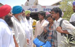 Agriculturists are camping at railway stations to hire farm labour in paddy season.