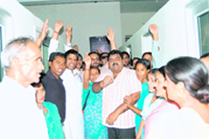 Congress workers protest against frequent power cuts at the office of the deputy general manager of Uttaranchal Power Corporation in Dehradun on Monday.