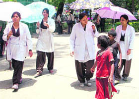 Medical students talk to beggars at the Gandhi Park in Dehradun.