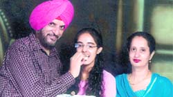Rinnie Brar (centre) celebrates her success with her parents after securing 68th rank in the CBSE All-India PMT/PDT entrance examination, 2009. She is the topper in Ludhiana