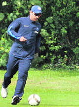 MS Dhoni plays football during a practice session in Nottingham on Monday.