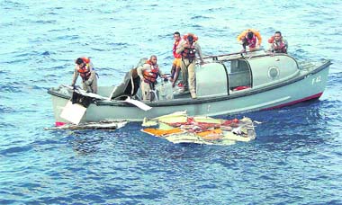 In this photo released by Brazils Air Force, officers recover debris belonging to the Air France Flight 447 in the Atlantic Ocean on Sunday. 