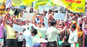 Teachers of recognised aided schools protest in Dehradun on Tuesday.