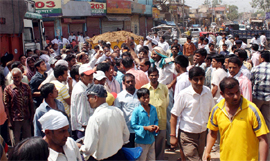 Residents protest against the Municipal Corporation at Pataudi Chowk in Gurgaon on Tuesday.