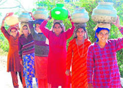 Scarcity forces women to cover long distances to get water in Mandi district.