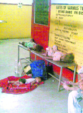 Children lie unattended in a corridor of District Hospital, Kathua.