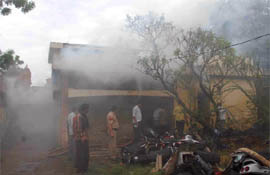 Smoke comes out of a building that caught fire in Faridabad on Wednesday.