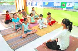 Children perform yoga at Promise Institute in Dehradun.