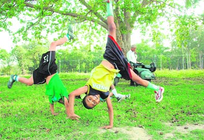Boys have fun at a summer football camp in Dehradun.