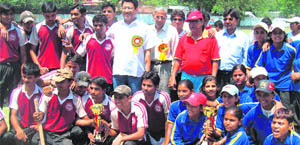 Winnners of National Tennis Ball cricket tournament pose with their trophies in Dehradun on Wednesday.