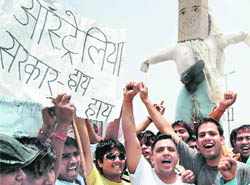 People hold a protest in Faridabad on Wednesday against attacks on the Indian community in Australia.