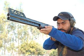 Currently ranked as No. 11 in the world, Ronjan does some target practice to hone his skills.