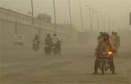 Motorists struggle to drive during a duststorm that hit Gurgaon on 