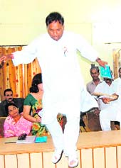 WELL DONE: A ward member jumps into the well of the House during the MC meet in Haridwar on Thursday. 