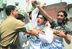 The police arrests activists of the Jammu and Kashmir Freedom League protesting against the Shopian incident in Srinagar