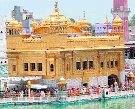 Devotees throng the Golden Temple in Amritsar on the occasion of Guru Gaddi Diwas of Guru Hargobind on Thursday.