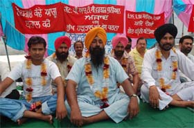 PRTC staff sit on hunger strike at the bus stand in Bathinda in support of their demands