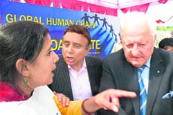 A hardcore environmentalist (left), Madhav Mehra, organiser of the event (centre) and a foreign delegate during a function of the Global Convention of Climate Security at Palampur Agriculture University