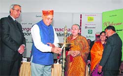 Chief Minister Prem Kumar Dhumal inaugurating the Tourism Conclave by lighting a lamp at Shimla
