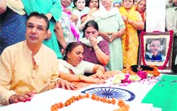 The parents mourn the death of their only son, Flt Lt Varun Kumar, at their residence in Jind 