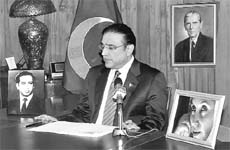 Pakistans President Asif Ali Zardari addresses the nation on a state-run television in Islamabad.