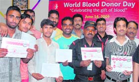 Blood donors with their certificate after donating blood at PGI, Chandigarh, on Sunday.