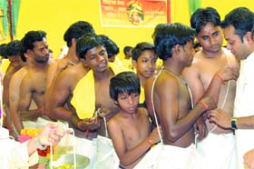 Founder and president of Swaraj, Sambit Patra ties sacred threads on Dalit boys during an Upanayan ceremony in New Delhi