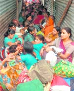Amarnath pilgrims await their boarding passes outside the base camp in Bhagwati Nagar, Jammu
