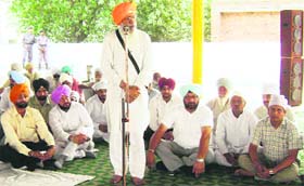 Sukhdev Singh Libra addresses a gathering at Sihar on Sunday.