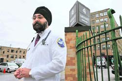 Dr Kamal S. Kalsi stands near Saint Joseph's hospital in Paterson, N.J., where he works.