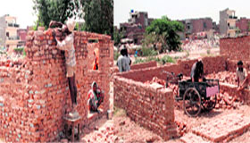 Illegal jhuggis being built on government land at Sector 25, Chandigarh, on Monday.