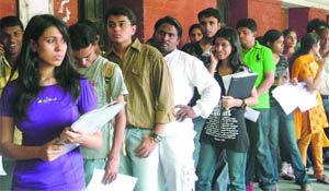 Students queue up to submit thier forms at an admission booth on the last day of submission of forms on Monday.